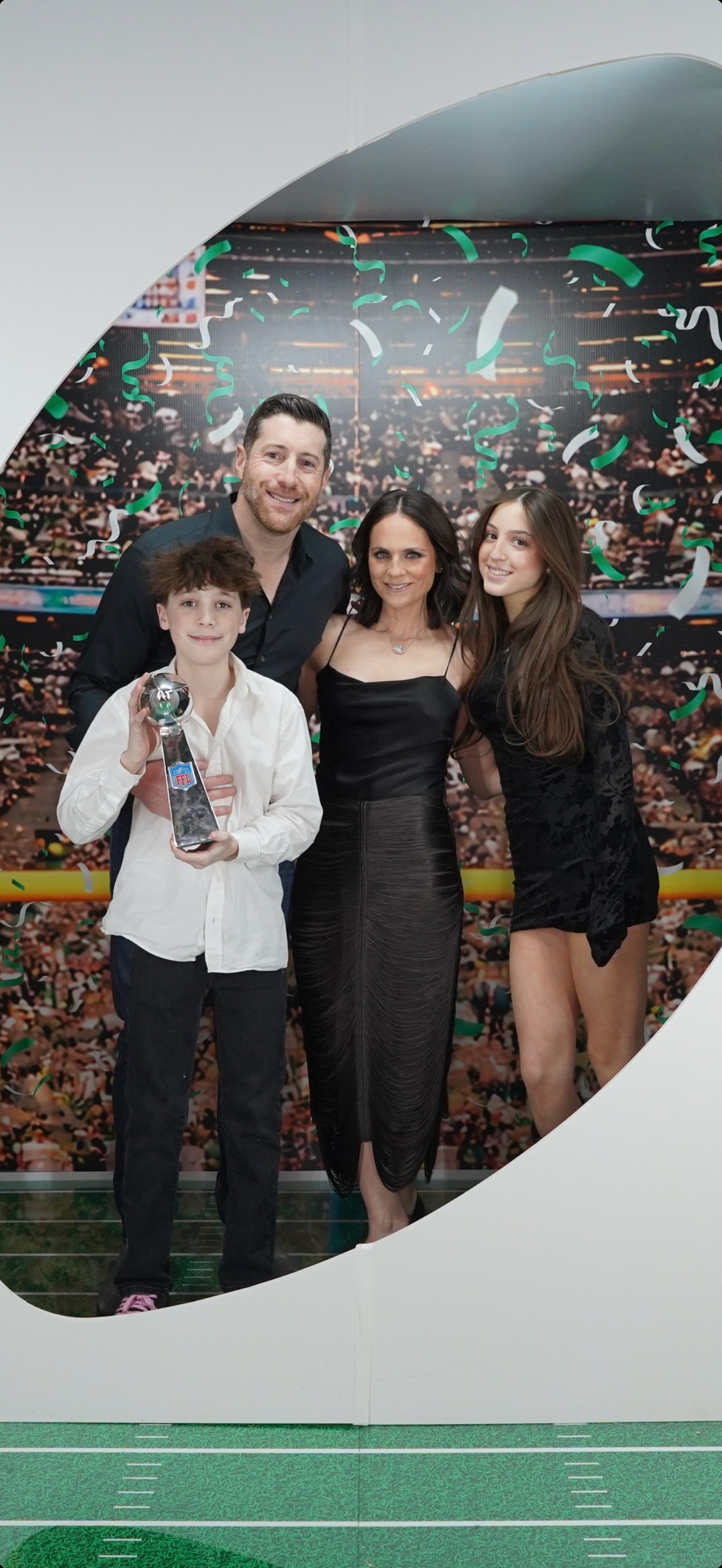 The Schifrin family with the fantasy football trophy